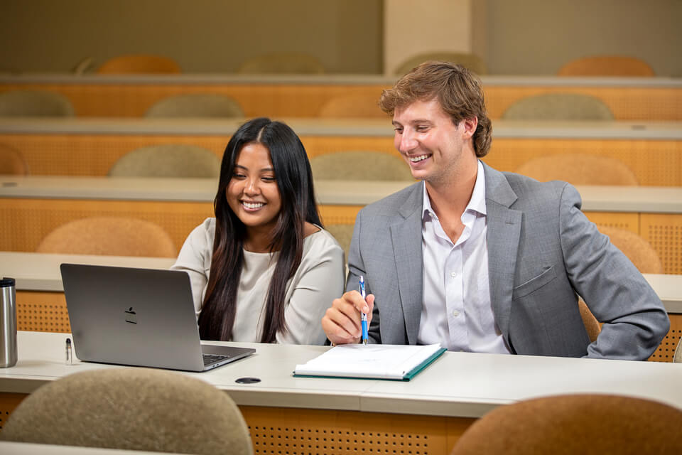 Two students working on a project together