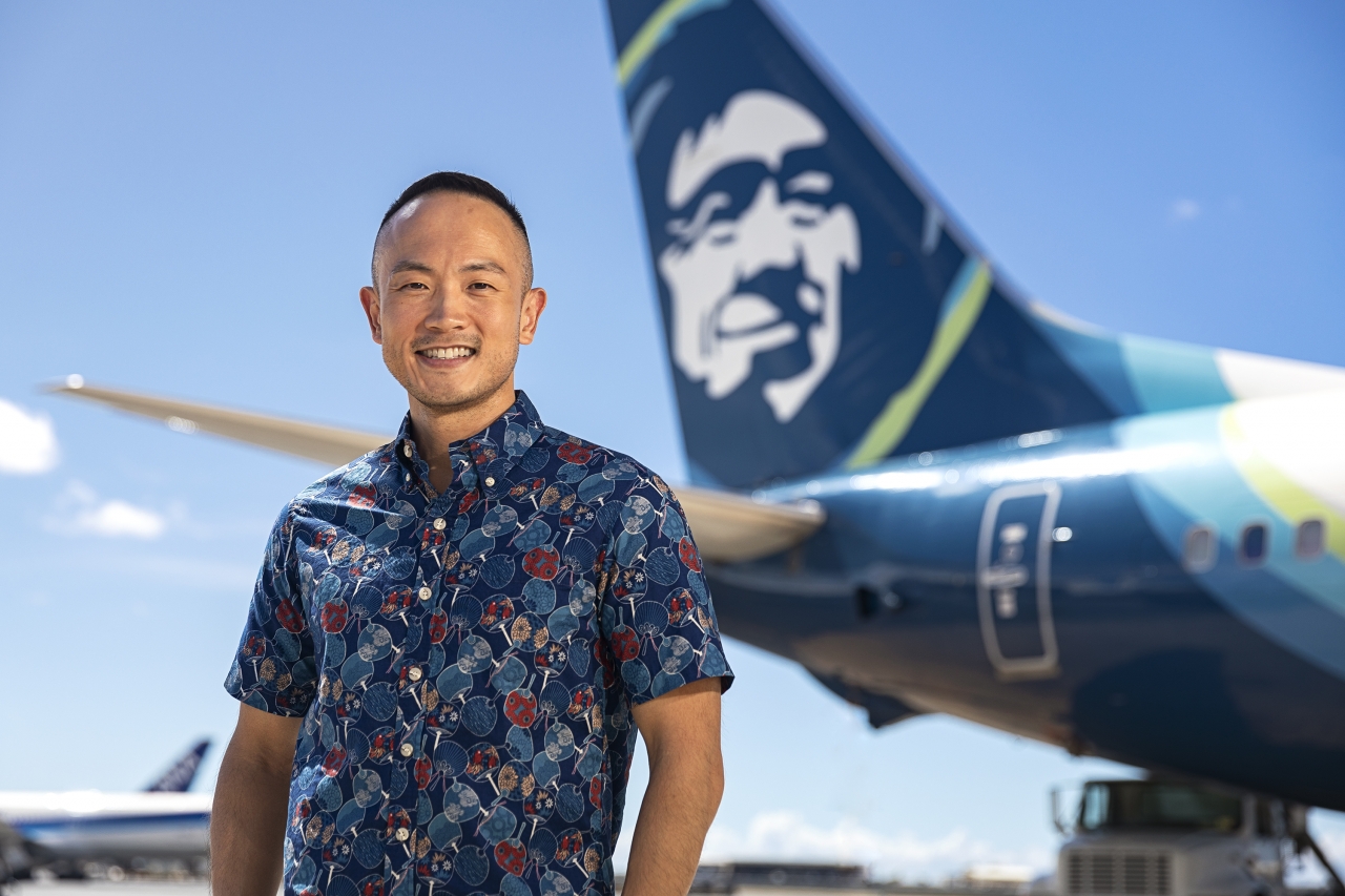 Daniel Chun in front of Alaska Airlines plane 
