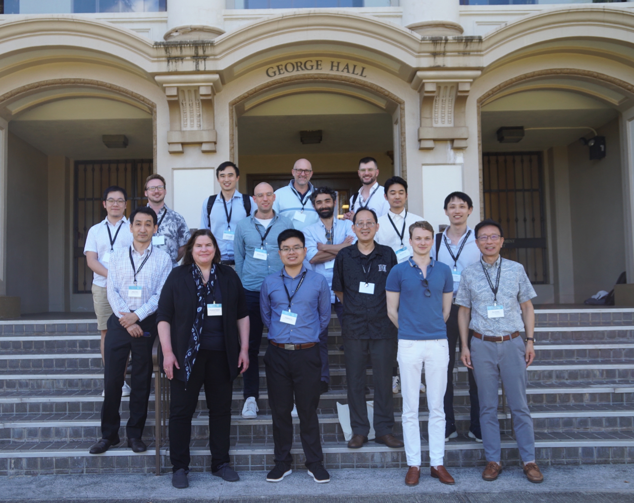 Attendees of the inaugural Innovations in Financial Intermediation Symposium pose for a picture in front of George Hall on June 27. 